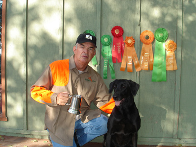 Trophies, cups, and ribbons earned by Dave Alvarez with his dog Windy